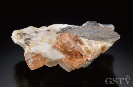 結晶質石灰岩に含まれるパキスタン産オレンジ-ピンクトパーズ原石